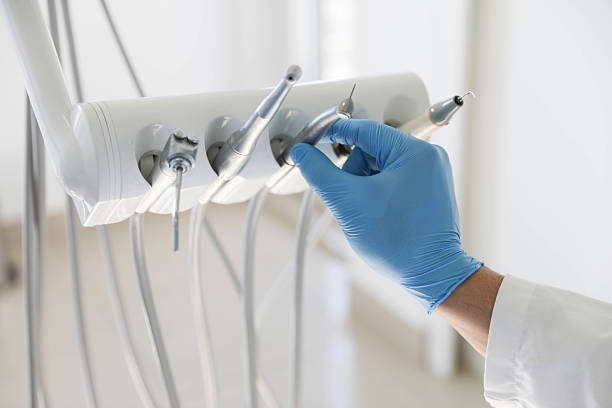 Professional Tooth Extraction technician working in Norman, OK